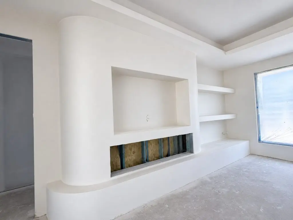 Curved TV feature wall and fireplace opening at the Mariginiup project